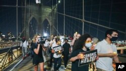 Protesters arrive at the Brooklyn Bridge after a march from the Barclays Center in New York, Aug. 21, 2020. Grieving families organized the "March for the Dead" to mourn American losses during the coronavirus pandemic. (John Nacion/STAR MAX)