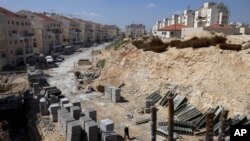 FILE- In this March 14, 2011, file photo, a general view of a construction site in the West Bank Jewish settlement of Modiin Illit. 