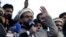 FILE - Hafiz Saeed, chief of Pakistani religious group Jamaat-ud-Dawa, addresses a rally for Kashmir Day in Lahore, Pakistan, Feb. 5, 2019.