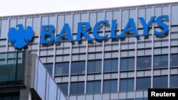 FILE - The logo of Barclays bank is seen at its office in the Canary Wharf business district of London, April 1, 2013.