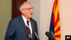 FILE - Former Sen. Jon Kyl, R-Ariz., talks about his appointment by Gov. Doug Ducey, R-Ariz., to fill Sen. John McCain's seat in the U.S. Senate at a news conference at the Arizona Capitol, Sept. 4, 2018.