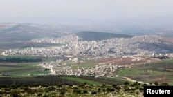 FILE - A general view shows the Kurdish city of Afrin, in Aleppo's countryside, Syria, March 18, 2015.