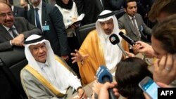 FILE - In this photo taken July 01, 2019, Saudi Arabia's Energy Minister Khaled al-Falih (R) and Saudi Deputy Oil Minister Prince Abdulaziz bin Salman bin Abdulaziz talk to the press on the sidelines of an oil meeting in Vienna, Austria.