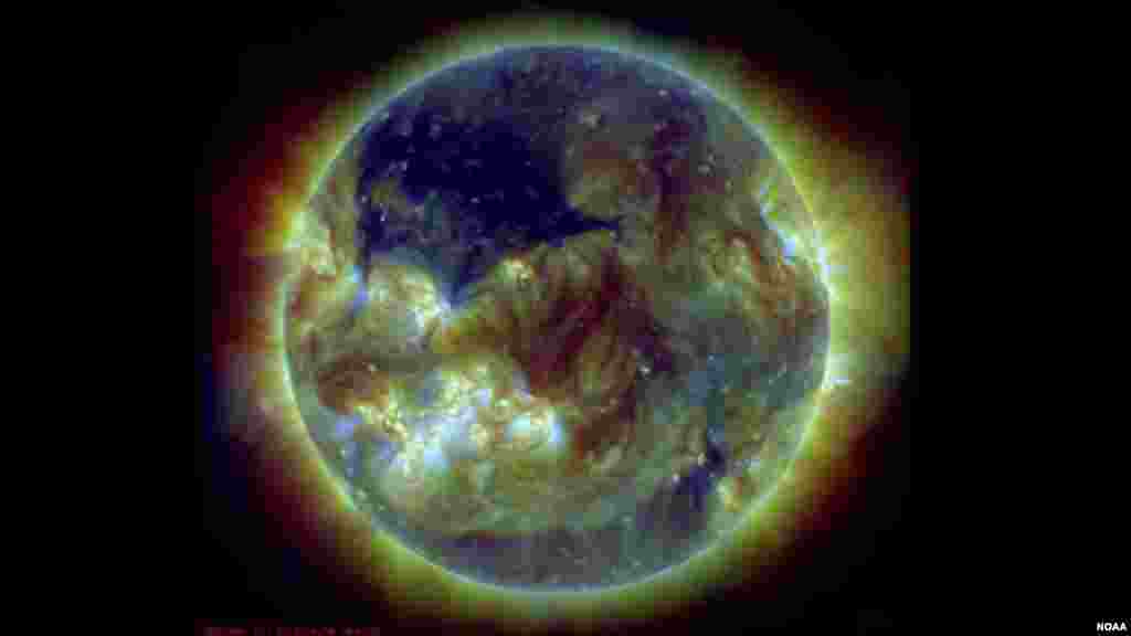 A coronal hole on the sun, seen here in dark blue, is an area of the sun's atmosphere, the corona, where the magnetic field opens up and the material flows quickly out. (Photo: NOAA Space Weather Prediction Center)