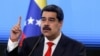 FILE - Venezuelan President Nicolas Maduro speaks during a news conference in Caracas, Dec. 8, 2020.