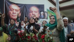 Supporters of Pakistani former Prime Minister Nawaz Sharif celebrate the release of their leader, outside a hospital where Sharif admitted in Lahore, Pakistan, Oct. 25, 2019.