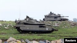 Israeli soldiers take part in an exercise in the Israeli-occupied Golan Heights, near the ceasefire line between Israel and Syria, March 20, 2017. 