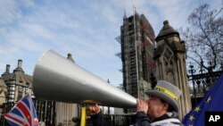 Anti Brexit campaigner Steve Bray demonstrates outside Parliament in London, Jan. 15, 2020. Britain is due to leave the European Union on Jan. 31.
