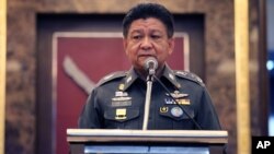 Thai police spokesman Prawut Thavornsiri speaks at a press conference at police headquarters, Bangkok, Thailand, Friday, Sept. 4, 2015. 