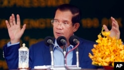 Cambodia's Prime Minister Hun Sen delivers a speech during a groundbreaking ceremony to build the country's first expressway, in Kampong Speu province, south of Phnom Penh, Cambodia, Friday, March 22, 2019.