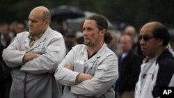  PSA Peugeot-Citroen employees in front of factory in Aulnay-sous-Bois, north of Paris, July 12, 2012.
