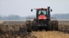 FILE - A farmer cultivates his field near Farmingdale, Ill., Dec. 4, 2009.