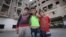 Syrian youngsters pose in front of the Ouzai building. With some families here for more than three years, many have grown up here. (Photo - J. Owens/VOA)
