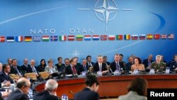 NATO Secretary General Jens Stoltenberg (C) addresses a NATO defense ministers meeting at the Alliance's headquarters in Brussels, Belgium, Feb. 10, 2016. 