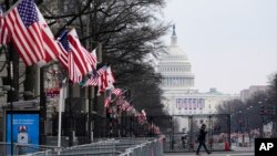 A view down Pennsylvania Avenue shows the security around the Capitol Hill in Washington, Friday, Jan. 15, 2021, ahead of the inauguration of President-elect Joe Biden and Vice President-elect Kamala Harris. (AP Photo/Susan Walsh)