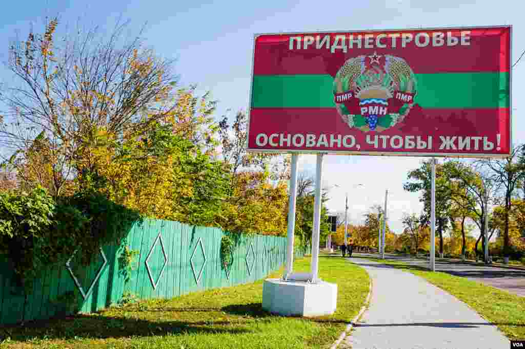 Once in Transdniester, Latin letters vanish, and everything -- in Russian and Romanian, is written with Cyrillic letters. This billboard with the 'national' emblem reads: "Transdniester: Created for Survival!" (Vera Undritz for VOA)