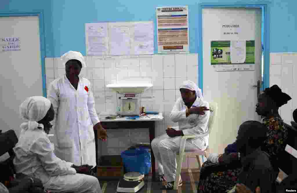 A poster displaying a government message against Ebola is displayed prominently at a maternity hospital, in Abidjan, Ivory Coast, Aug. 14, 2014.
