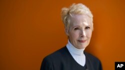 FILE - E. Jean Carroll poses for a photo in New York, June 23, 2019.