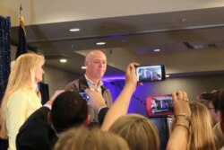 FILE - Republican Greg Gianforte greets supporters after winning Montana's sole congressional seat, May 25, 2017, in Bozeman, Mont.