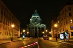 This long exposure photo shows an empty street near Paris' Pantheon square, March 21, 2020. President Emmanuel Macron said that for 15 days starting at noon Tuesday, people will be allowed to leave the place they live only for necessary activities.