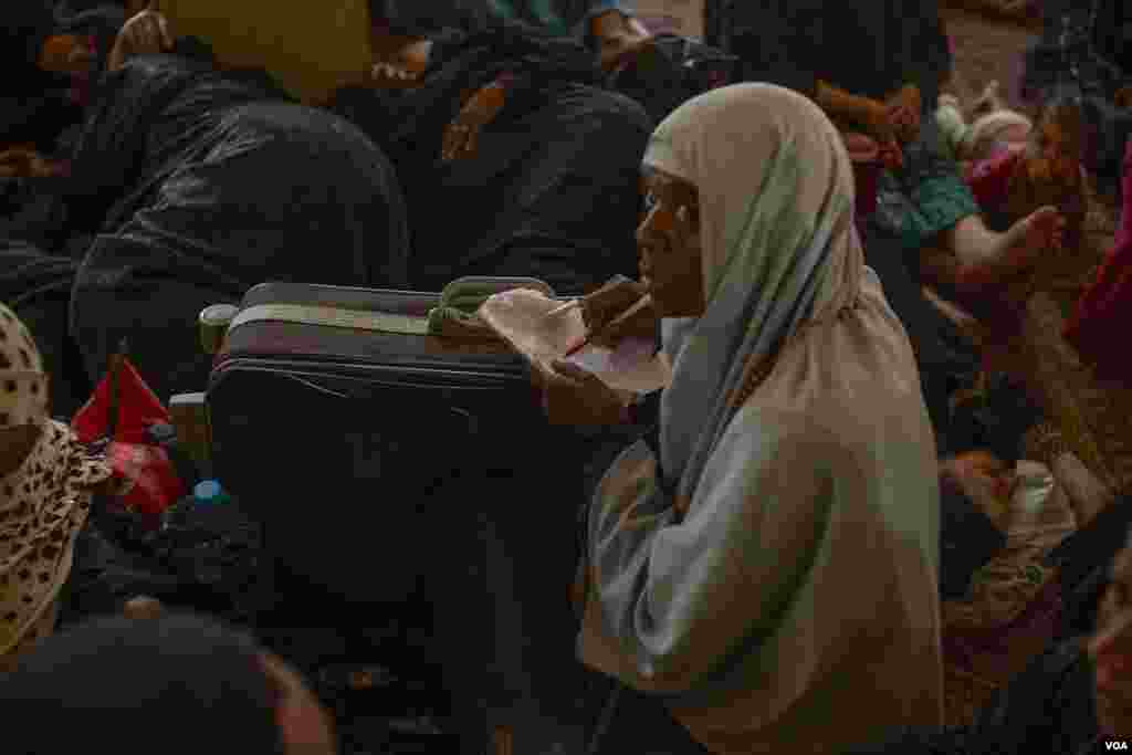 Commonly pilgrims to Humaithera show devotion by practicing eccentric rituals like crafting talismans or breaking hexes around the shrine of Sheikh Abu Al-Hassan Al-Shazly. (H. Elrasam/VOA)