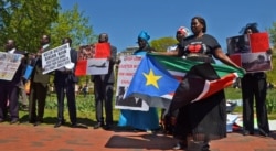 South Sudanese protest outside the White House in Washington, D.C. on Tuesday, Apr. 28, 2015. The protesters want President Salva Kiir to step down and say more targeted sanctions are needed against those blocking peace in South Sudan.