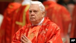 FILE - In this March 12, 2013, photo, Cardinal Bernard Law attends a Mass for the election of a new pope celebrated inside St. Peter's Basilica, at the Vatican. 