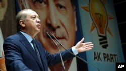Turkey's President Recep Tayyip Erdogan addresses the members of his ruling party in Ankara, Turkey, Oct. 13, 2017. 