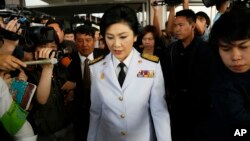 Thailand's Prime Minister Yingluck Shinawatra leaves a meeting with election commissioners at the Army Club, in Bangkok, Thailand, Jan. 28, 2014.