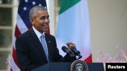 U.S. President Barack Obama speaks during a joint news conference with Italian Prime Minister Matteo Renzi in the Rose Garden of the White House in Washington, Oct. 18, 2016. 