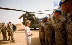 FILE - German Defense Minister Ursula von der Leyen speaks to German army Bundeswehr soldiers during a visit to Camp Castor in Gao, Mali, Dec. 19, 2016.
