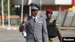 FILE - Burkina Faso's coup leader General Gilbert Diendere arrives at the airport to greet foreign heads of state in Ouagadougou, Burkina Faso, Sept. 23, 2015.