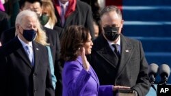 Kamala Harris is sworn in as Vice President by Supreme Court Justice Sonia Sotomayor as her husband Doug Emhoff holds the Bible during the 59th Presidential Inauguration at the U.S. Capitol in Washington, Wednesday, Jan. 20, 2021. (AP Photo/Patrick Semansky, Pool)