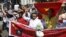 Protesters hold banners while chanting slogans during an anti-China protest along a street in Hanoi, July 22, 2012.