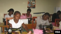 FILE - Girls learn to make sanitary pads from imported water-proof materials in project sponsored by the Malawi NGO, Girls Empowerment Network (VOA / L. Masina) 