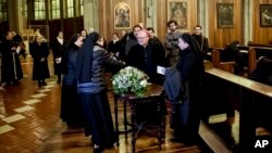Archbishop Charles Scicluna, center, attends a meeting with priest and nuns at the San Mateo Cathedral in Osorno, Chile, Saturday, June 16, 2018. 