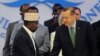 Somalia's PM Abdiweli Mohamed Ali, left, shakes hands with Turkish counterpart before he addresses a conference that aims to support Somalia in a transition process, Istanbul, Turkey, June 1, 2012.
