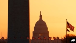 The Washington Monument and the U.S. Capitol are seen in Washington, March 18, 2020.