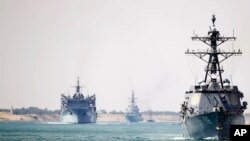 FILE - In this photo provided by the U.S. Navy, the Abraham Lincoln Carrier Strike Group transits the Suez Canal, May 9, 2019. Deployed strike group assets included the Spanish navy's Mendez Nunez frigate.