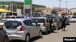 Motorists wait to buy petrol in Harare, Zimbabwe.