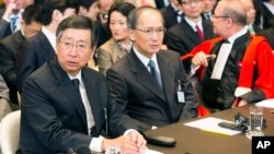 Japanese delegation from left: Deputy Minister of Foreign Affairs Koji Tsuruoka, Ambassador of Japan to the Netherlands Yasumasa Nagamine and Alain Pellet, professor of Paris Ouest University at the International Court of Justice in The Hague, June 26, 2013.