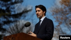 Le Premier ministre du Canada, Justin Trudeau, lors d'une conférence de presse sur le coronavirus à Rideau Cottage, Ottawa, Ontario, Canada, 13 mars 2020. (Reuters/Blair Gable)