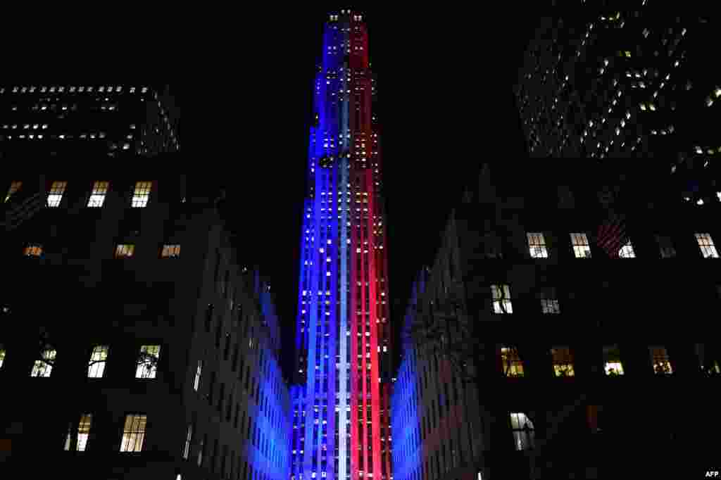 Rockefeller Center and Rockefeller Plaza is lit up in red and blue to mark the electoral progress of Hillary Clinton and Donald Trump and a map of the United States superimposed on the skating rink, Nov. 7, 2016, as part of NBC&#39;s election night coverage.