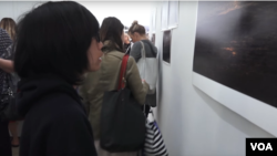 Bayu Lukman admiring one of his photos on display at the Pablove Shutterbugs program photo gallery.