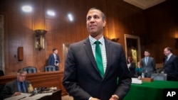 FCC Chairman Ajit Pai prepares to testify about his budget before a Senate Appropriations subcommittee on Capitol Hill in Washington, May 17, 2018. 
