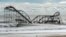 November 1, 2012: The remnants of a roller coaster sits in the surf three days after Hurricane Sandy came ashore in Seaside Heights, New Jersey.