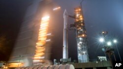 In this photo released by NASA, the mobile service tower at SLC-3 is rolled back to reveal the United Launch Alliance (ULA) Atlas-V rocket with NASA's InSight spacecraft onboard, May 4, 2018, at Vandenberg Air Force Base in Calif. 