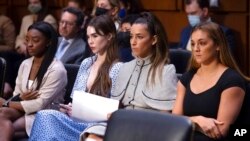 United States gymnasts from left, Simone Biles, McKayla Maroney, Aly Raisman and Maggie Nichols, arrive to testify during a Senate Judiciary hearing regarding the Larry Nassar investigation on Capitol Hill, Sept. 15, 2021.