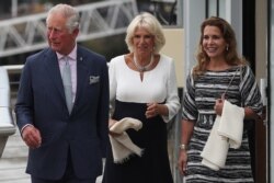 FILE - Britain's Prince Charles, Prince of Wales, left, and his wife Britain's Camilla, Duchess of Cornwall, center, walk with Jordan's Princess Haya bint al-Hussein in London, Sept. 5, 2018.