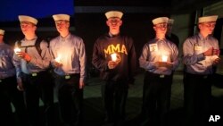 Maine Maritime Academy students attend a vigil of hope for the missing crew members of the U.S. container ship El Faro, Tuesday evening, Oct. 6, 2015.
